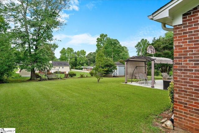 200 Camille St, Easley, SC 29642 - view of green lawn with a patio area, a shed, and a carport