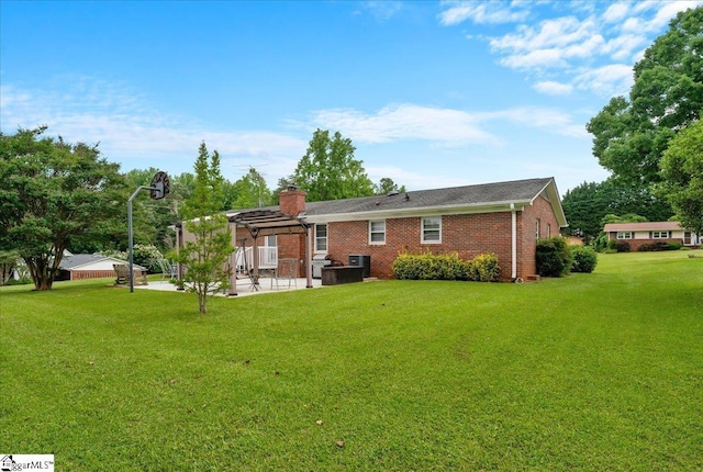200 Camille St, Easley, SC 29642 - rear view of property featuring a yard, a patio, brick siding, a chimney, and a pergola