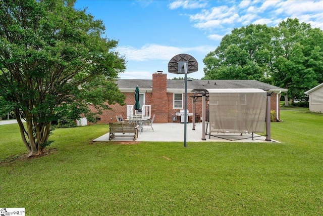 200 Camille St, Easley, SC 29642 - rear view of property featuring a patio area, brick siding, a yard, and a chimney