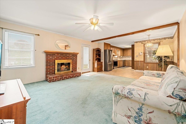 200 Camille St, Easley, SC 29642 - living area with a ceiling fan, light colored carpet, a fireplace, wooden walls, and crown molding