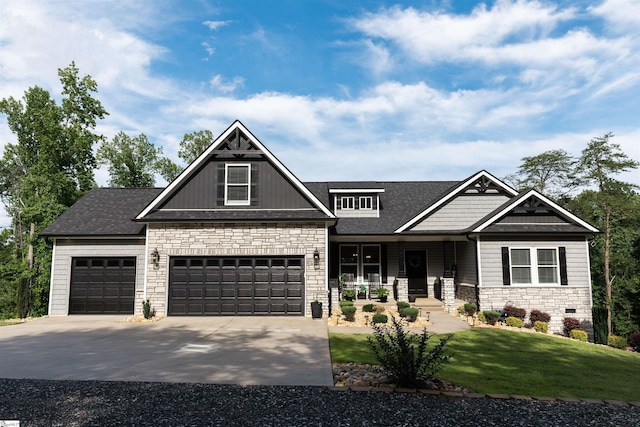 140 Holmes Dr, Spartanburg, SC 29303 - craftsman-style home featuring stone siding, a porch, a front yard, driveway, and roof with shingles