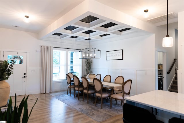 140 Holmes Dr, Spartanburg, SC 29303 - dining room with light wood-style flooring, coffered ceiling, beamed ceiling, a wainscoted wall, and stairs