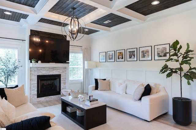 140 Holmes Dr, Spartanburg, SC 29303 - living area with coffered ceiling, beam ceiling, light wood-style flooring, a fireplace, and a chandelier