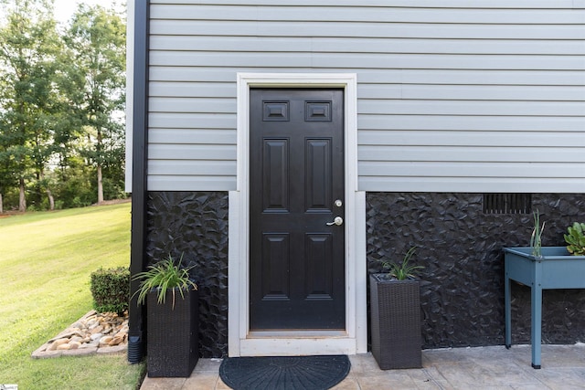 140 Holmes Dr, Spartanburg, SC 29303 - property entrance with a yard and stone siding
