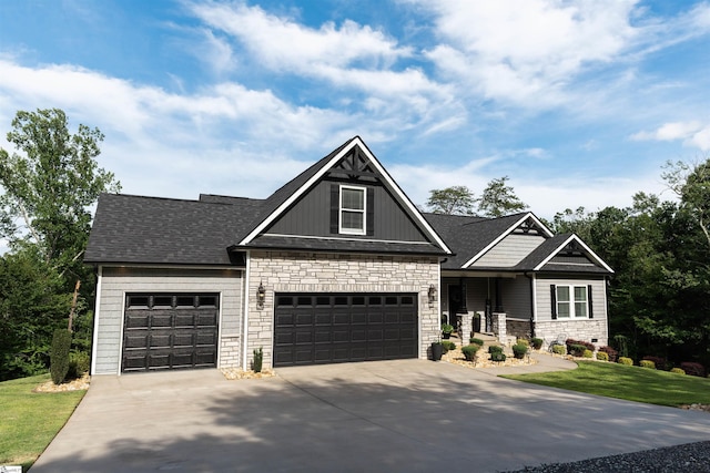 140 Holmes Dr, Spartanburg, SC 29303 - craftsman house featuring stone siding, driveway, a front lawn, a shingled roof, and a garage