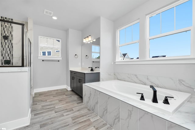 913 Wild Pine Ct, Duncan, SC 29334 - full bath with vanity, a shower stall, a bath, wood finished floors, and recessed lighting