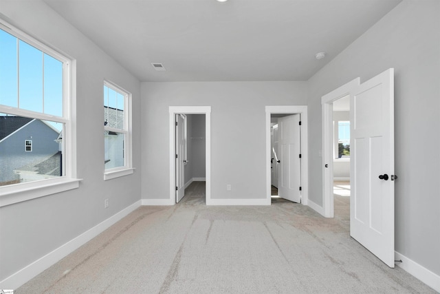 913 Wild Pine Ct, Duncan, SC 29334 - unfurnished bedroom featuring carpet flooring and a walk in closet