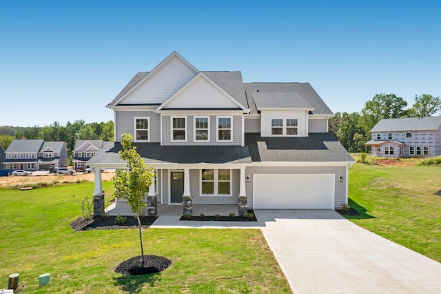 913 Wild Pine Ct, Duncan, SC 29334 - craftsman-style home featuring covered porch, driveway, a front yard, an attached garage, and a shingled roof