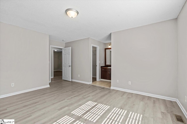 263 Cornelson Dr, Greer, SC 29651 - unfurnished bedroom with light wood-style flooring and connected bathroom