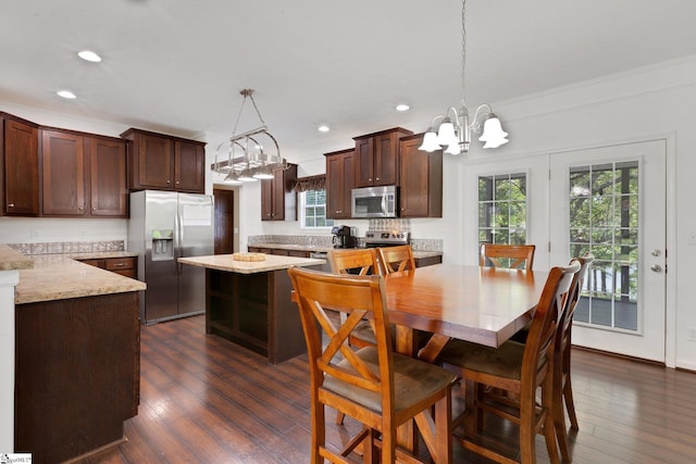 1893 Lake Cunningham Rd, Greer, SC 29651 - kitchen with stainless steel appliances, a chandelier, dark brown cabinetry, recessed lighting, and dark wood finished floors