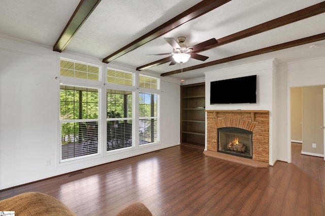 1893 Lake Cunningham Rd, Greer, SC 29651 - unfurnished living room with beam ceiling, a brick fireplace, ceiling fan, and wood finished floors