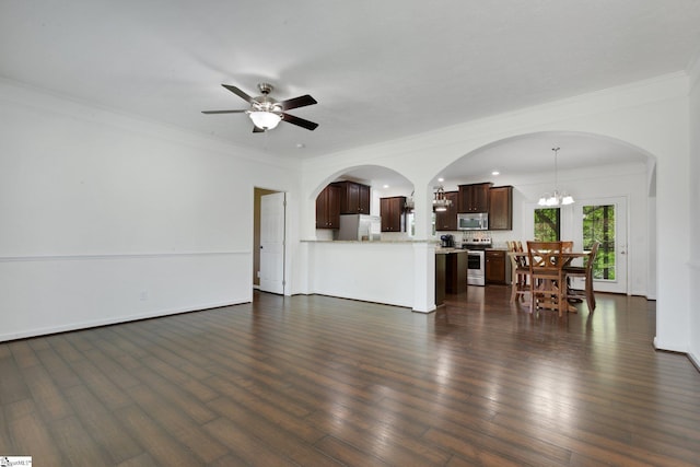 1893 Lake Cunningham Rd, Greer, SC 29651 - living room with ornamental molding, arched walkways, a ceiling fan, a chandelier, and dark wood finished floors