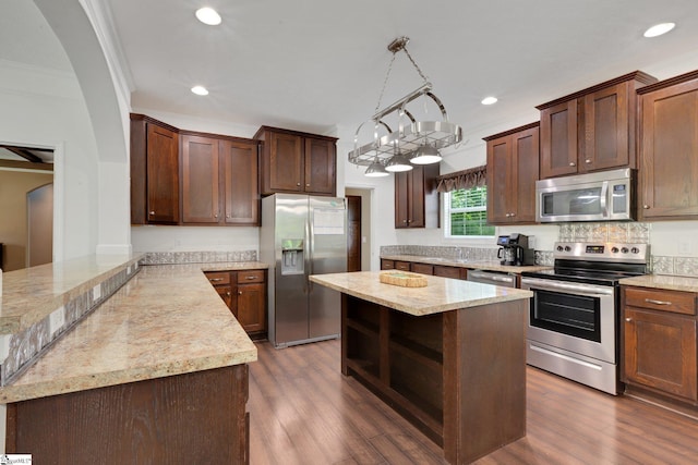 1893 Lake Cunningham Rd, Greer, SC 29651 - kitchen with stainless steel appliances, dark wood-style flooring, recessed lighting, a center island, and light stone counters