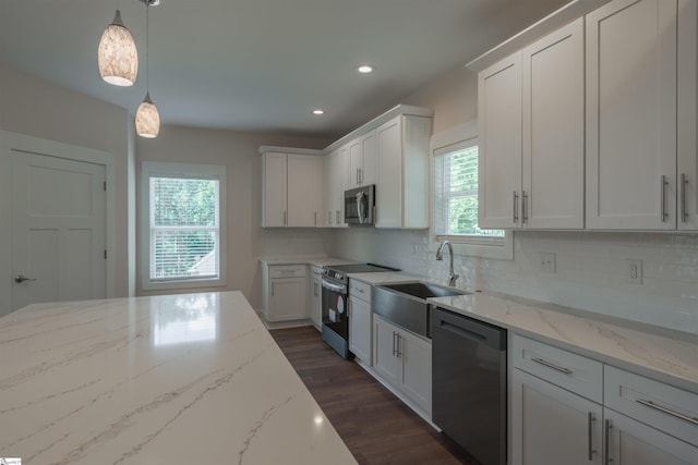 18003 Clermont Cir, Seneca, SC 29678 - kitchen with stainless steel appliances, backsplash, dark wood-type flooring, recessed lighting, and light stone counters