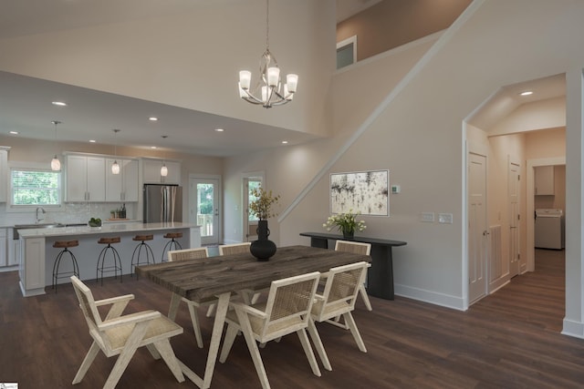 18003 Clermont Cir, Seneca, SC 29678 - dining space with washer / clothes dryer, dark wood-type flooring, a chandelier, recessed lighting, and a high ceiling