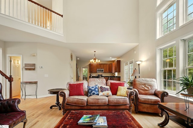 108 Myrtle Way, Greer, SC 29650 - living room with a high ceiling, healthy amount of natural light, a chandelier, and light wood-style flooring