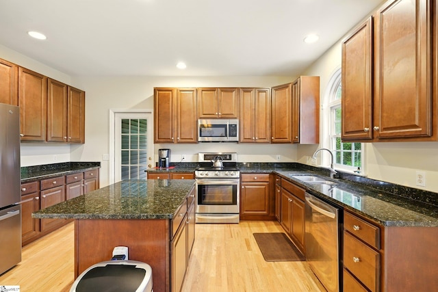 108 Myrtle Way, Greer, SC 29650 - kitchen with stainless steel appliances, light wood finished floors, recessed lighting, dark stone countertops, and a center island