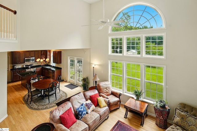 108 Myrtle Way, Greer, SC 29650 - living area with a towering ceiling, light wood finished floors, and a ceiling fan