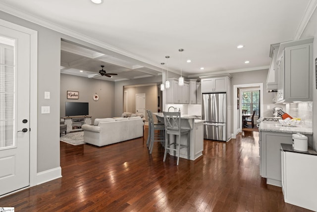 203 Piper Glen Ln, Inman, SC 29349 - kitchen featuring freestanding refrigerator, recessed lighting, open floor plan, a kitchen breakfast bar, and dark wood finished floors