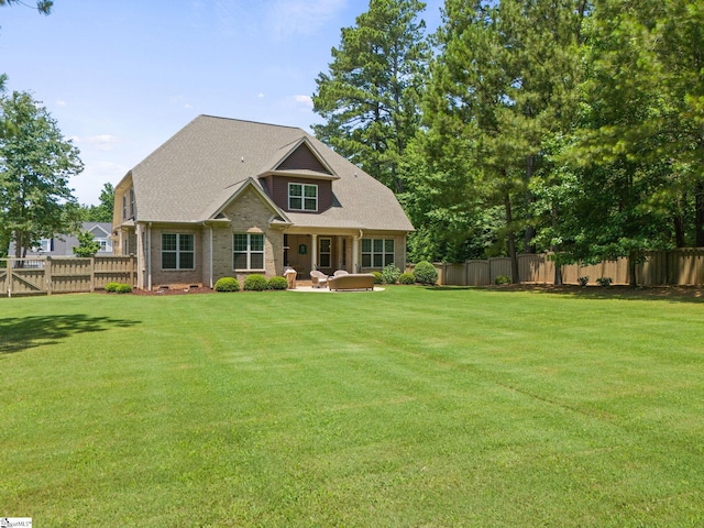 203 Piper Glen Ln, Inman, SC 29349 - back of property with a fenced backyard, a patio, and brick siding