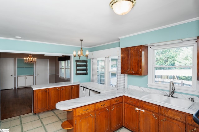 106 Thackston St, Fountain Inn, SC 29644 - kitchen with a chandelier, a peninsula, light countertops, and ornamental molding