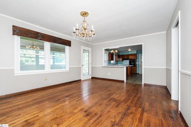 106 Thackston St, Fountain Inn, SC 29644 - unfurnished living room featuring a chandelier, dark wood-style floors, a wainscoted wall, and crown molding