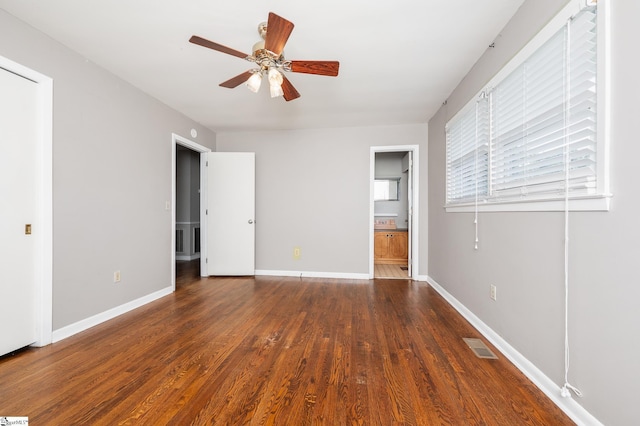 106 Thackston St, Fountain Inn, SC 29644 - unfurnished bedroom with wood finished floors, ensuite bathroom, and a ceiling fan