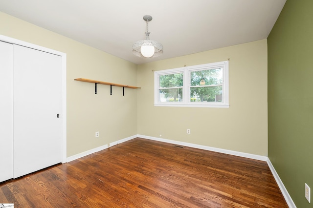 106 Thackston St, Fountain Inn, SC 29644 - spare room featuring wood finished floors and baseboards