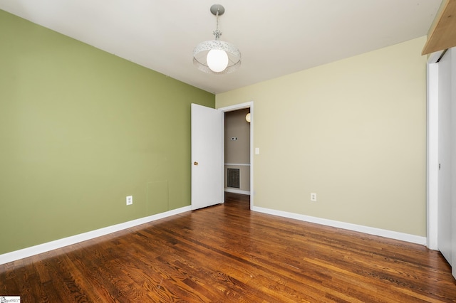 106 Thackston St, Fountain Inn, SC 29644 - spare room featuring wood finished floors and baseboards