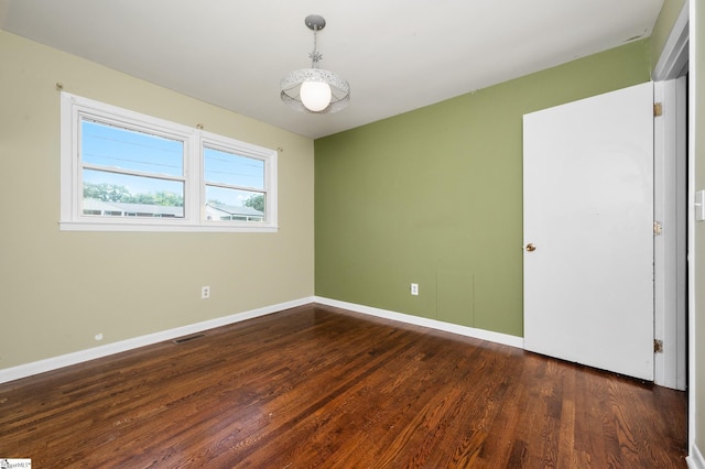 106 Thackston St, Fountain Inn, SC 29644 - empty room with dark wood finished floors and baseboards