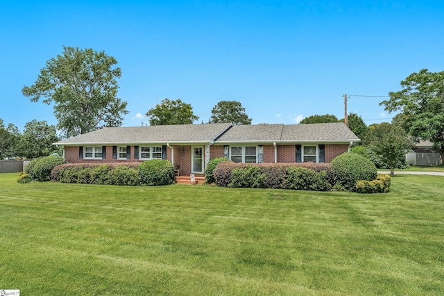 106 Thackston St, Fountain Inn, SC 29644 - ranch-style home with a front lawn and brick siding