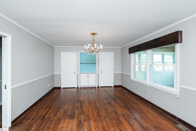 106 Thackston St, Fountain Inn, SC 29644 - empty room featuring dark wood-type flooring, a chandelier, and crown molding