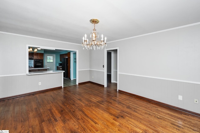 106 Thackston St, Fountain Inn, SC 29644 - unfurnished living room with a chandelier, wood finished floors, and ornamental molding