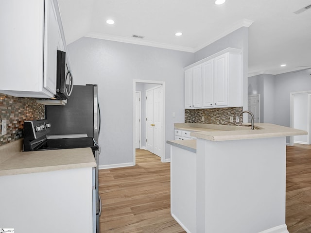 68 Arbours W Ln, Moore, SC 29369 - kitchen with appliances with stainless steel finishes, light wood finished floors, white cabinets, a peninsula, and crown molding