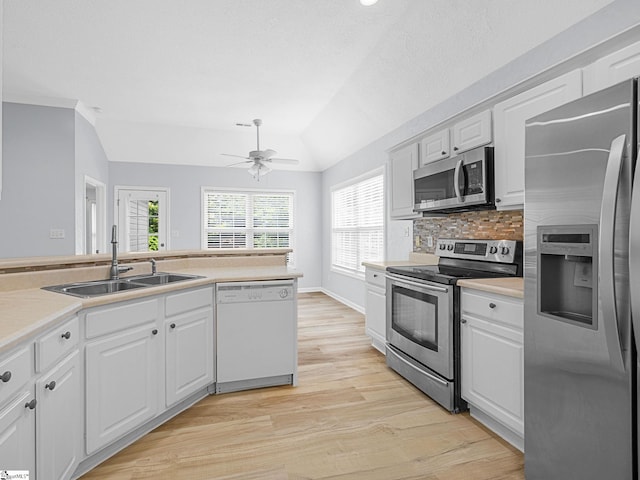 68 Arbours W Ln, Moore, SC 29369 - kitchen with stainless steel appliances, lofted ceiling, a ceiling fan, white cabinetry, and light wood-style floors