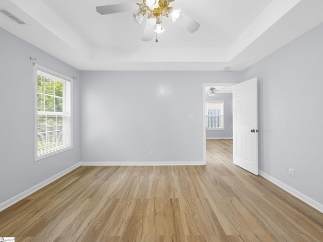 68 Arbours W Ln, Moore, SC 29369 - spare room with a raised ceiling, a ceiling fan, and light wood-type flooring