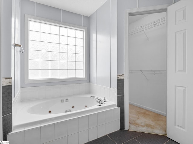 68 Arbours W Ln, Moore, SC 29369 - bathroom with a jetted tub, tile patterned flooring, and a walk in closet