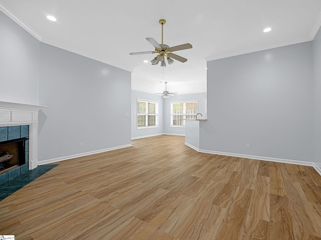 68 Arbours W Ln, Moore, SC 29369 - unfurnished living room with light wood-style flooring, ceiling fan, a fireplace, recessed lighting, and ornamental molding
