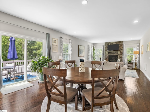 711 Hatwood Ct, Duncan, SC 29334 - dining area featuring a stone fireplace, dark wood-type flooring, plenty of natural light, and recessed lighting