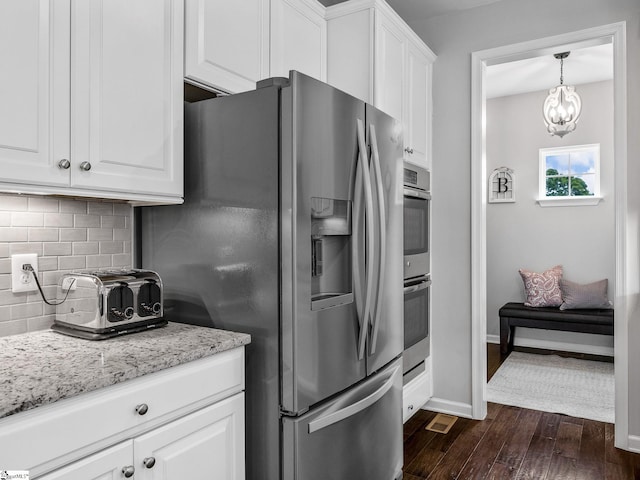 711 Hatwood Ct, Duncan, SC 29334 - kitchen with appliances with stainless steel finishes, decorative backsplash, dark wood-style floors, white cabinets, and light stone counters