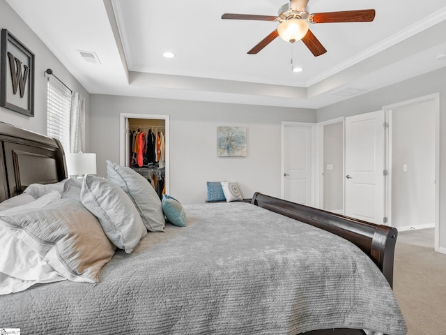 711 Hatwood Ct, Duncan, SC 29334 - bedroom with a tray ceiling, a walk in closet, light carpet, a closet, and recessed lighting