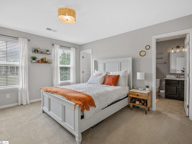 711 Hatwood Ct, Duncan, SC 29334 - bedroom featuring light colored carpet and ensuite bath