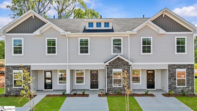 217 Islay Way, Anderson, SC 29621 - view of front of home featuring stone siding, a porch, board and batten siding, and a front yard