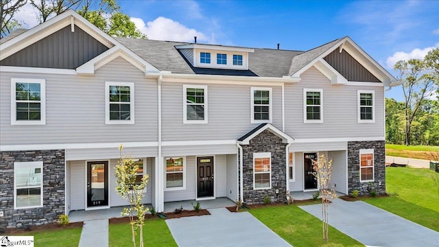 217 Islay Way, Anderson, SC 29621 - view of front facade featuring stone siding, board and batten siding, a front yard, and a porch