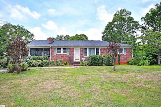 204 Jasper St, Easley, SC 29640 - single story home featuring brick siding, a chimney, a front lawn, and a sunroom