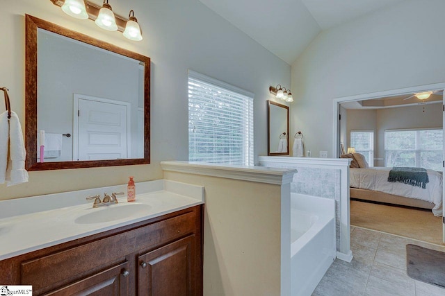 104 Saddlehorn Ln, Easley, SC 29642 - ensuite bathroom featuring plenty of natural light, vanity, a garden tub, and lofted ceiling