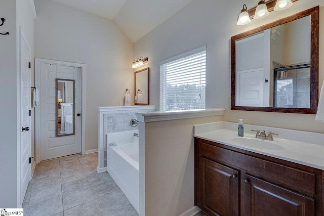 104 Saddlehorn Ln, Easley, SC 29642 - bathroom with a garden tub, lofted ceiling, vanity, and tile patterned flooring
