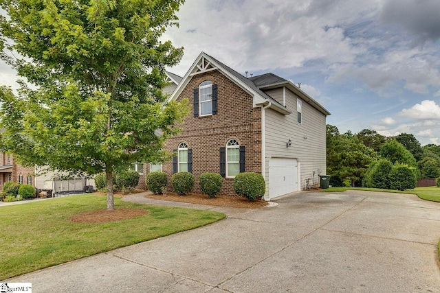 104 Saddlehorn Ln, Easley, SC 29642 - view of front facade with brick siding, driveway, an attached garage, and a front lawn