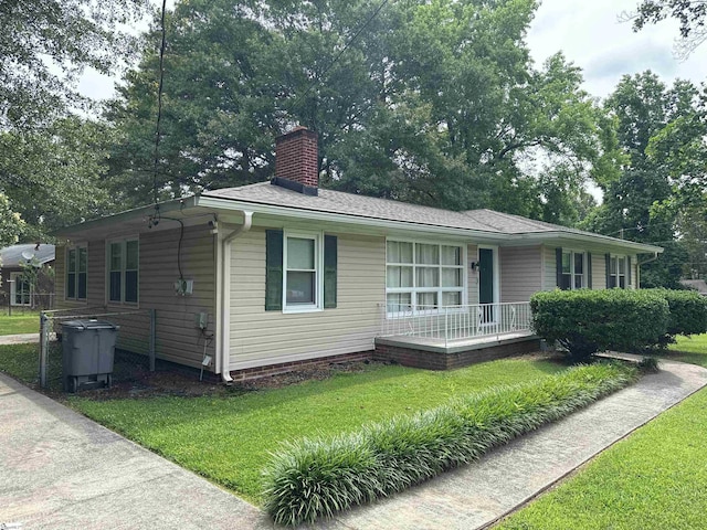 2 Runion Dr, Taylors, SC 29687 - view of front of home featuring a front lawn, a porch, and a chimney