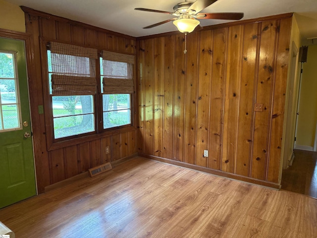 2 Runion Dr, Taylors, SC 29687 - unfurnished room with light wood-style floors, a ceiling fan, healthy amount of natural light, and wood walls